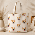 Natural canvas tote bag with repeating custom corgi face pattern