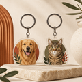 Two acrylic keychains with dog and cat portraits