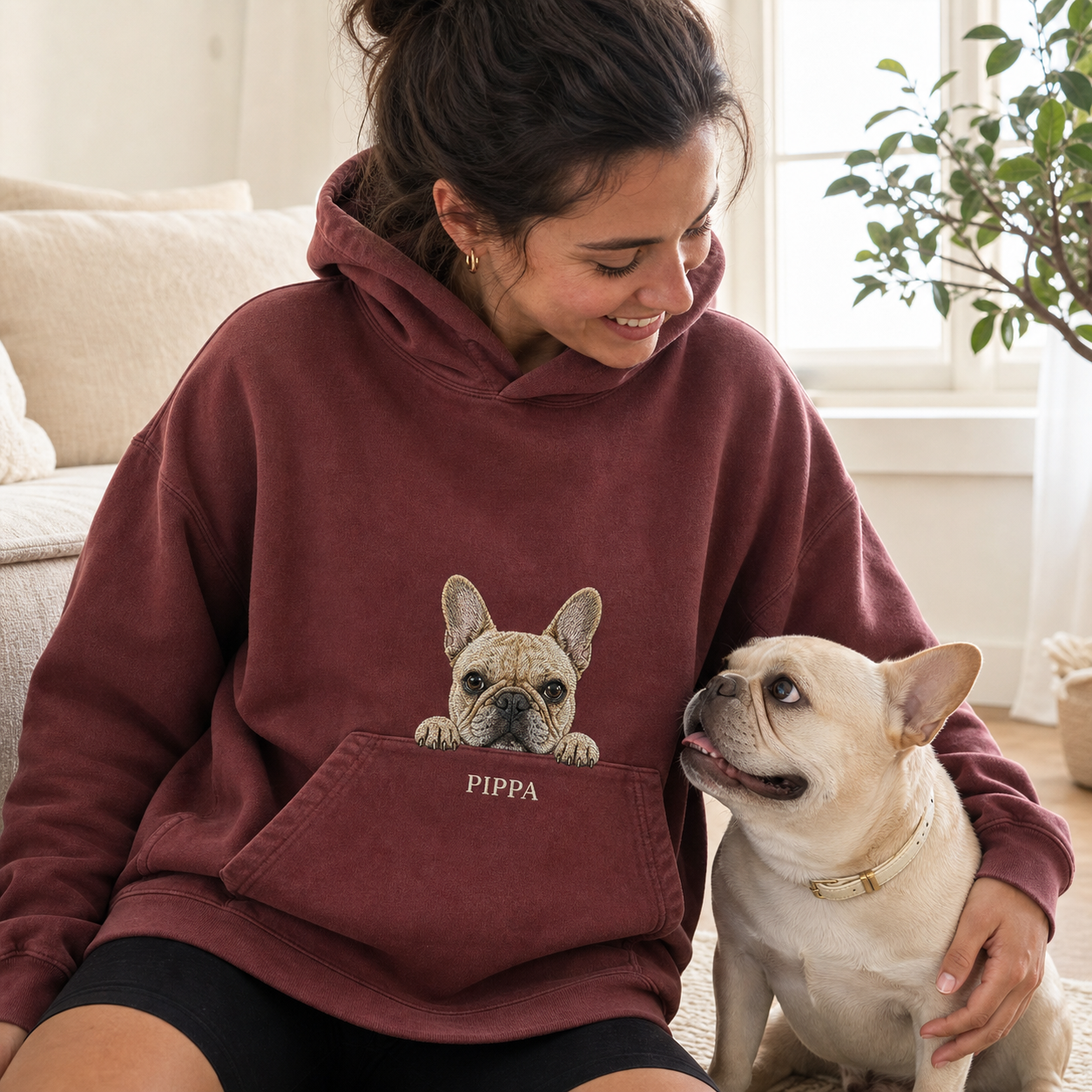 Woman wearing a burgundy custom French bulldog embroidered hoodie
