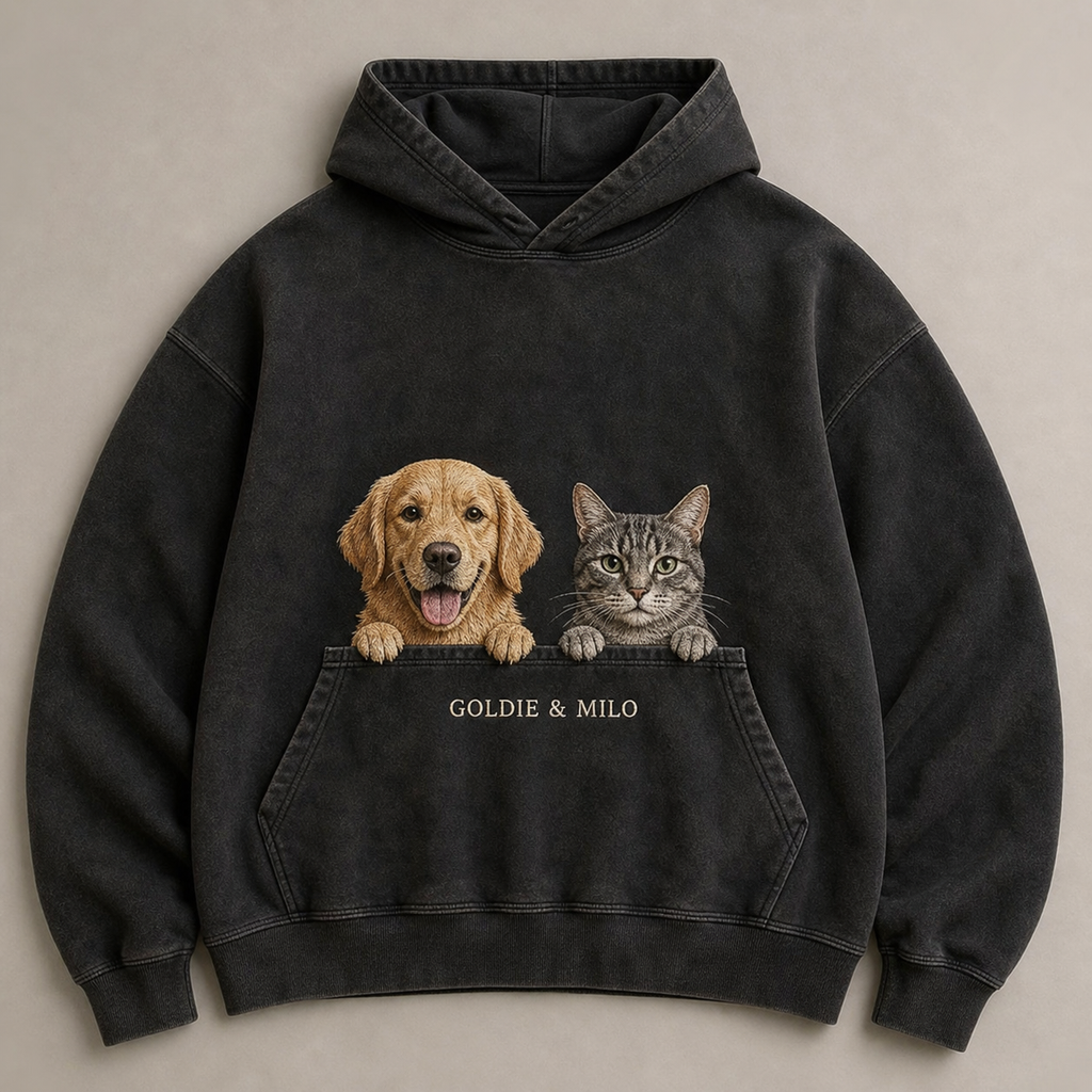 Two-pet dog and cat pocket peek embroidery on a black hoodie